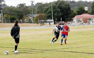 Matthew Carey (second player from left) playing for Darling Downs in a 2-0 win against Metropolitan East. Matthew Carey (second player from left) playing for Darling Downs in a 2-0 win against Metropolitan East.
